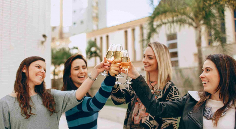 Friends gather to drink wine