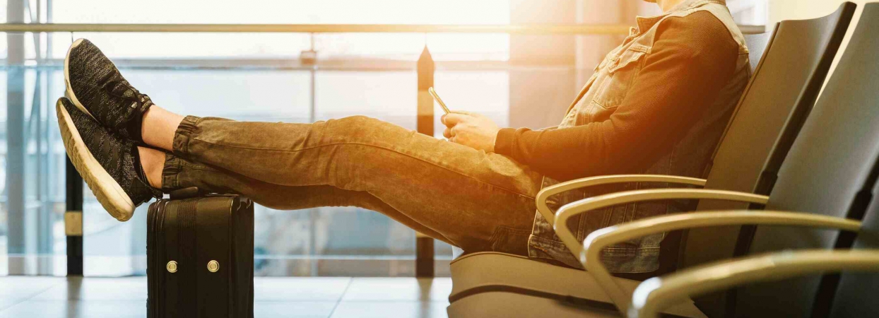 tourist awaits plane boarding during summer travel season