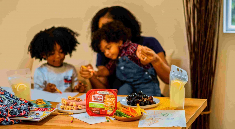 kids eating snack with their mother