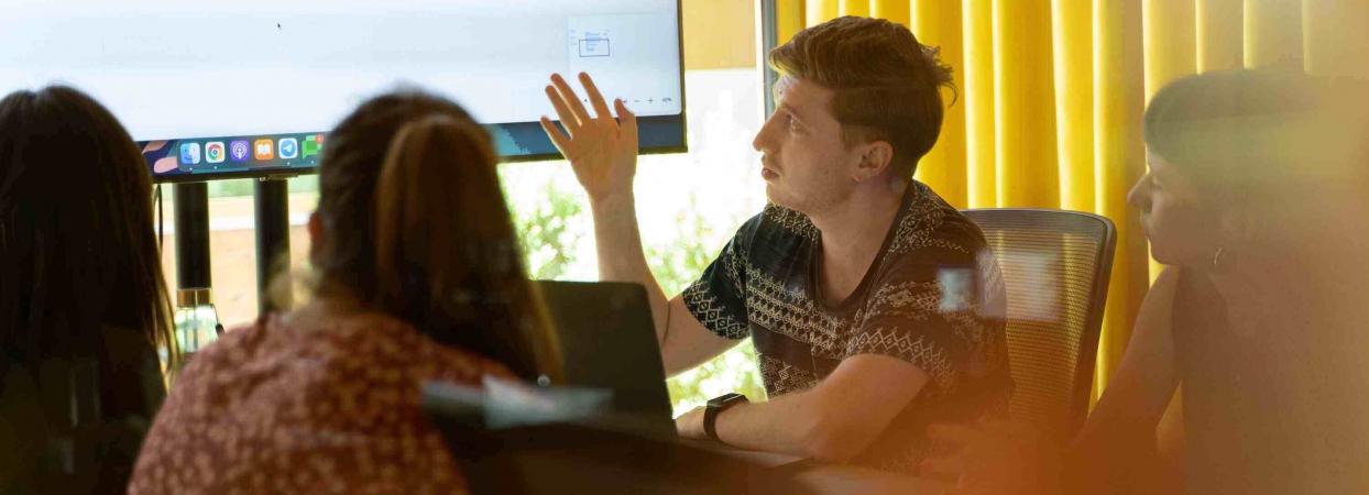 interns working at a computer