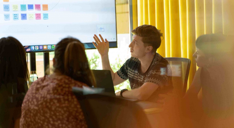 interns working at a computer