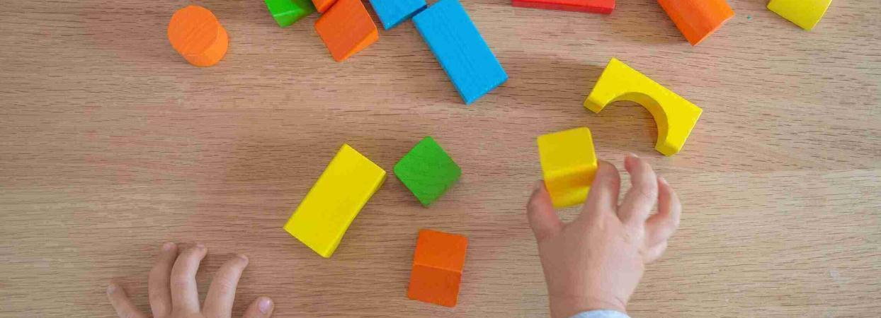 child playing with building blocks