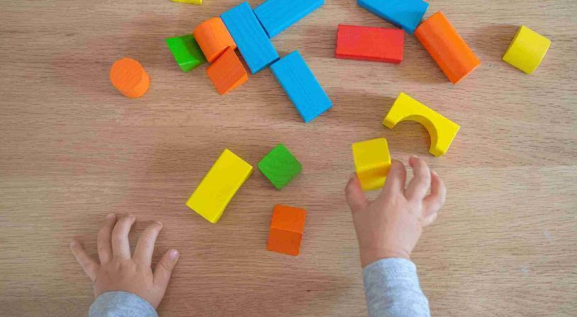 child playing with building blocks
