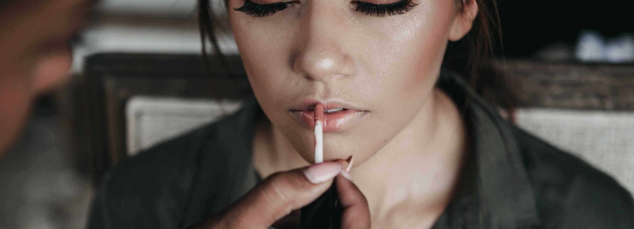 woman getting her makeup done