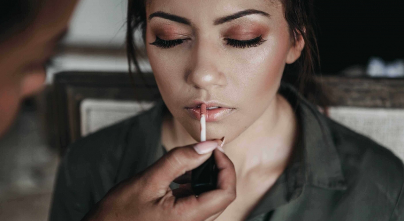 woman getting her makeup done