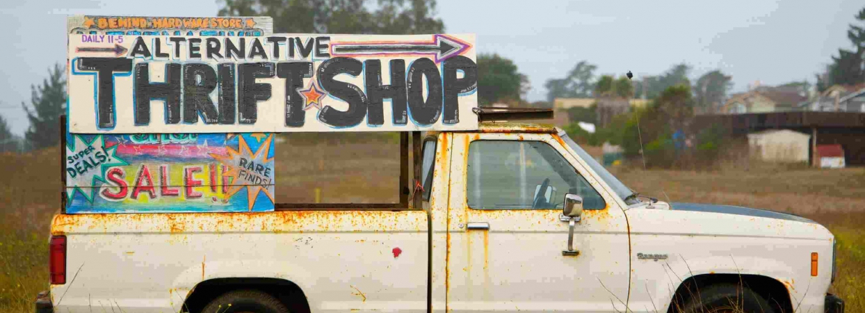 van with advertisement for a thrift shop