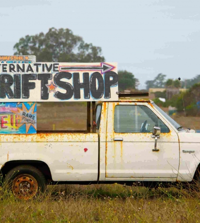 van with advertisement for a thrift shop