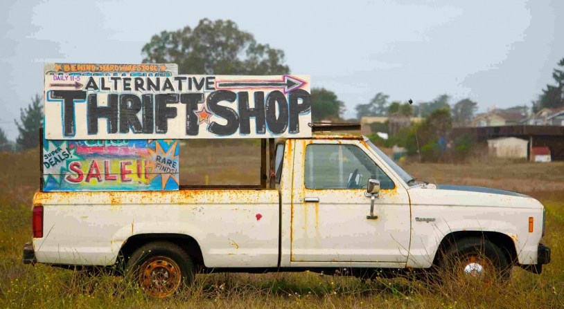 van with advertisement for a thrift shop