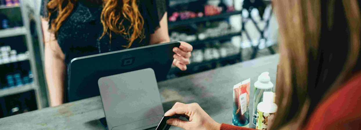 woman paying at checkout