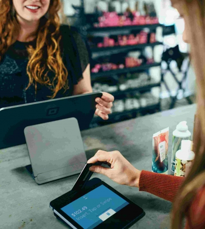 woman paying at checkout