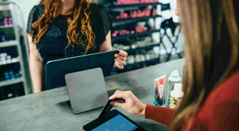 woman paying at checkout