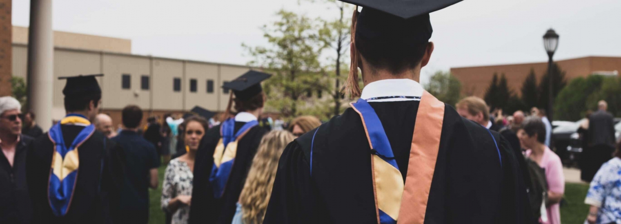 person standing at college graduation