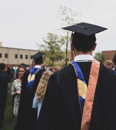 person standing at college graduation