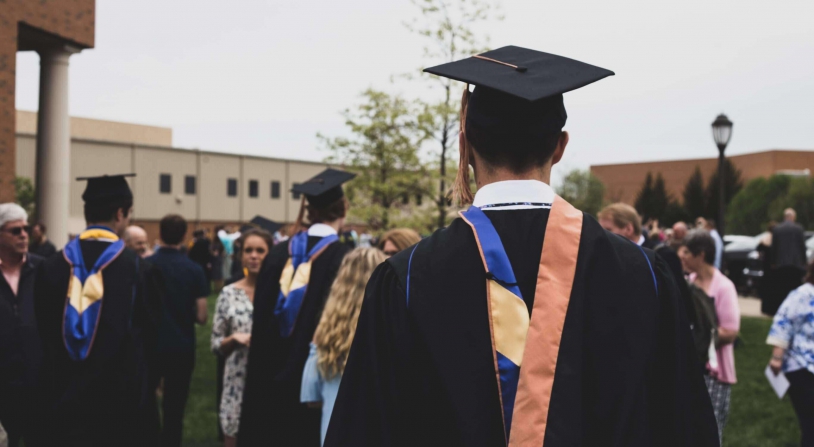 person standing at college graduation
