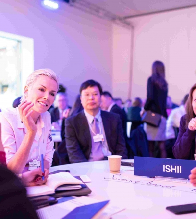 professionals sitting around a table networking