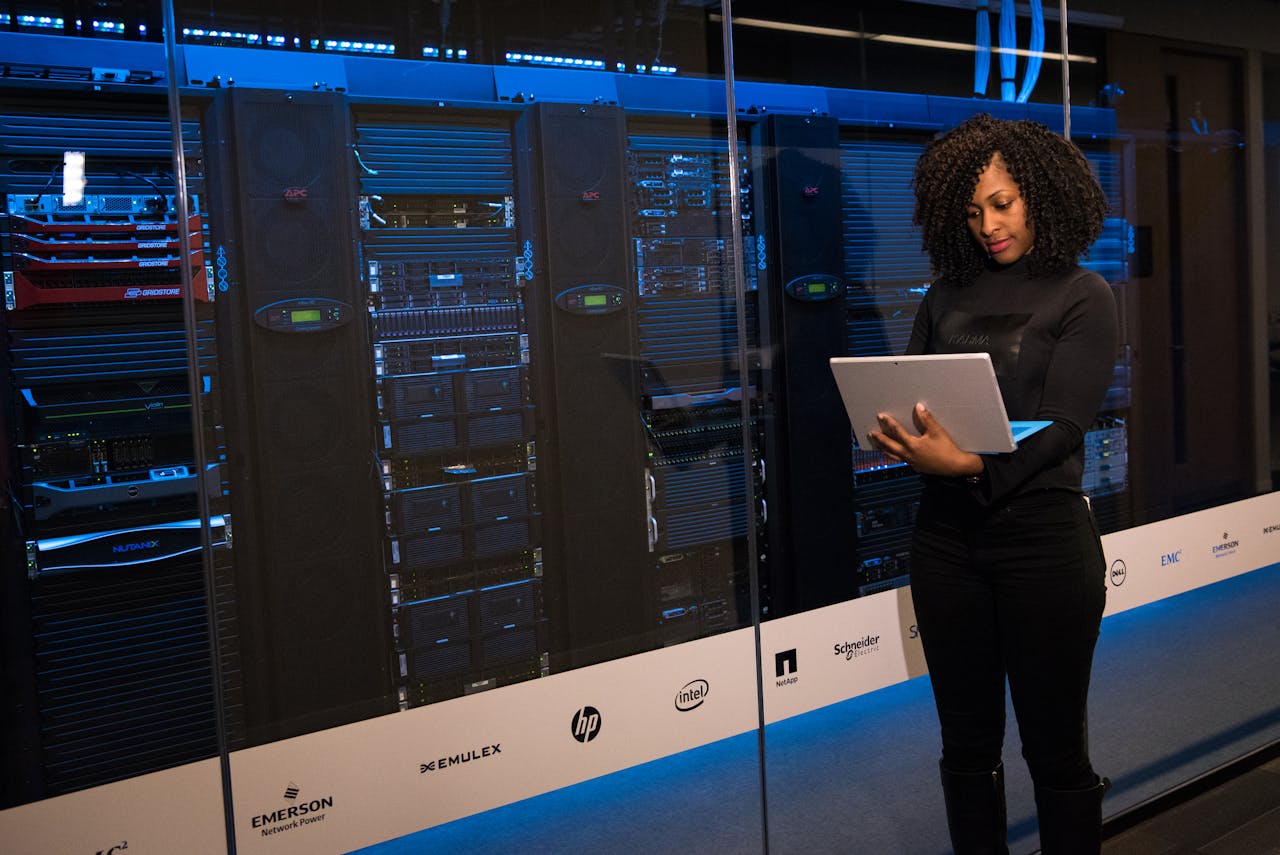 cybersecurity woman in front of servers
